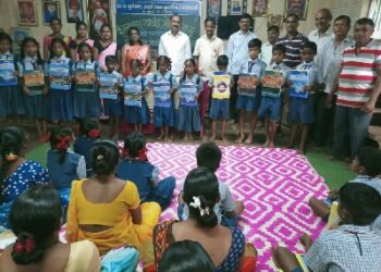 Distribution of educational materials by Om Bhojane