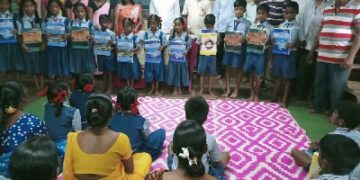 Distribution of educational materials by Om Bhojane