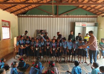 Distribution of educational material to Dodvali school