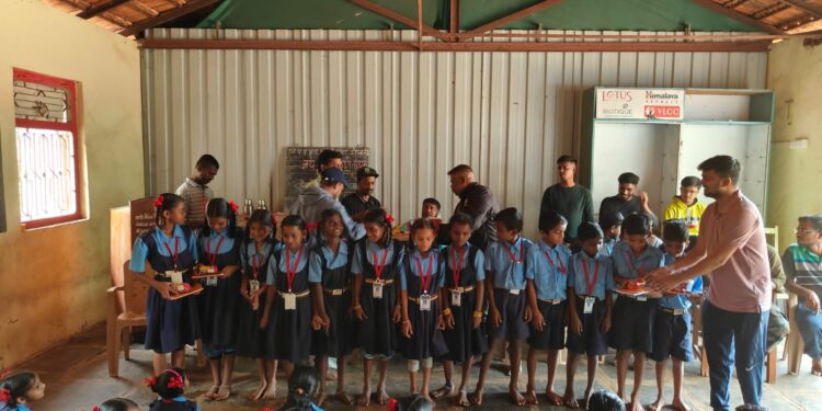 Distribution of educational material to Dodvali school