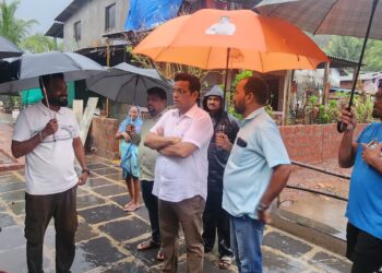 Pramod Gandhi inspected the damaged area.