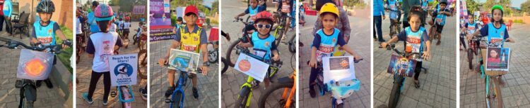 Child astronauts ride bicycles