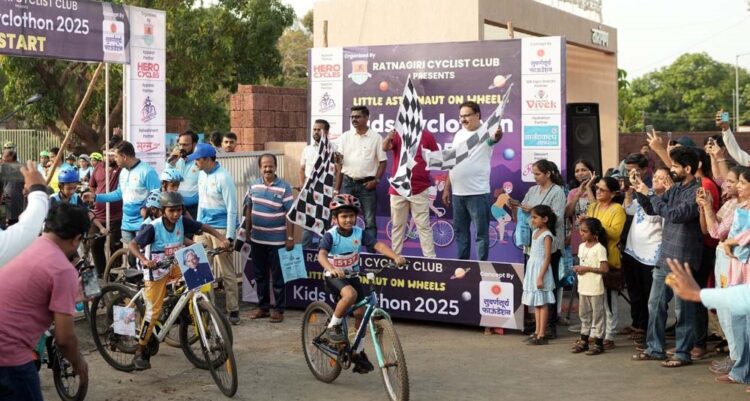 Child astronauts ride bicycles