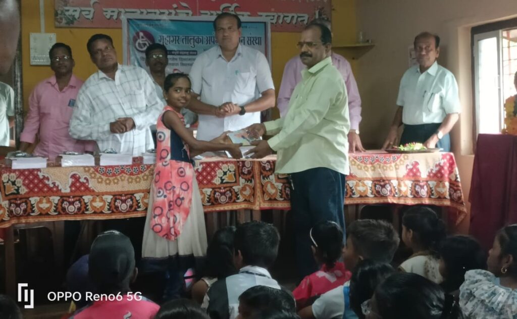 Distribution of educational material in Guhagar Handicapped Institute