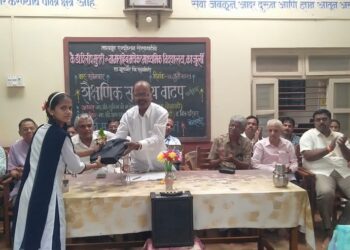 Distribution of educational materials in Kajurli School